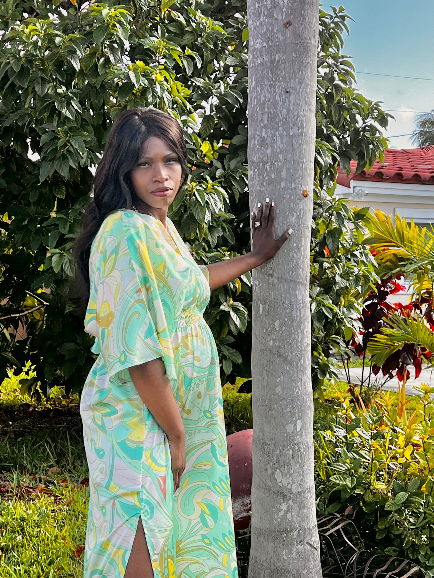 boutique : This gorgeous green print dress has a plunge V-neckline, side splits, an elasticated waist, and short sleeves with a romantic V cut open back. Made with a lightweight woven fabric.